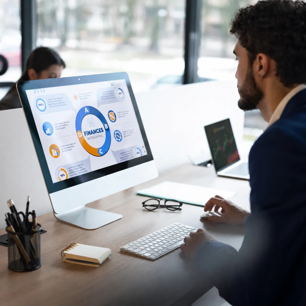 Business professional reviewing a financial dashboard on a desktop computer